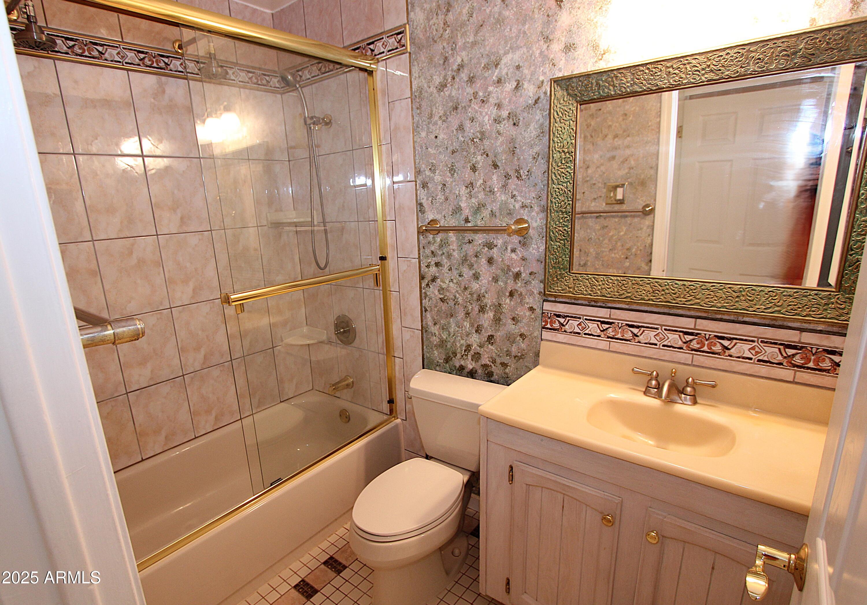 10411 North 11th Avenue, Unit 3 Phoenix, AZ 85021 - Photo 9 of 23 a bathroom with a sink toilet and shower