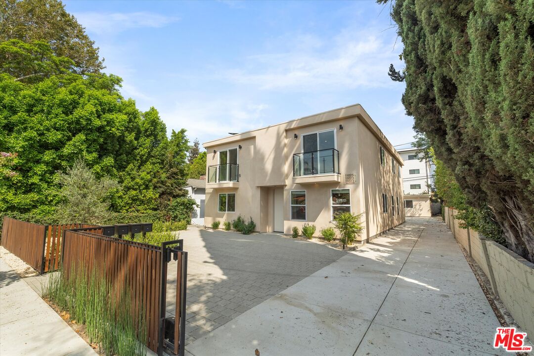 11025 1/2 Blix Street North Hollywood, CA 91602 - Photo 2 of 18 a front view of a house with a garden