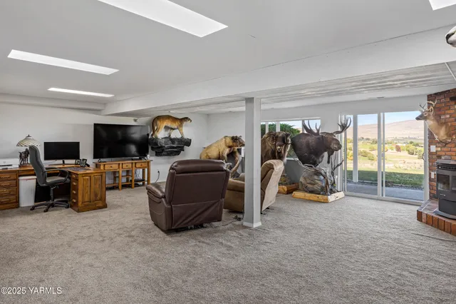 a view of living room with furniture and a flat tv screen