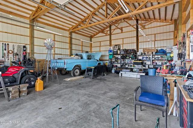 a living room with lots of furniture and a chandelier