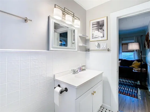a bathroom with a sink and a mirror