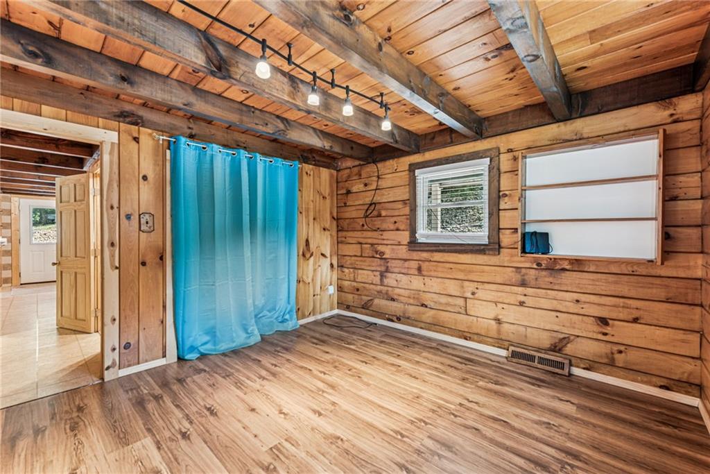 733 McKee Road White Oak, PA 15131 - Photo 13 of 36 a view of empty room with wooden floor and windows