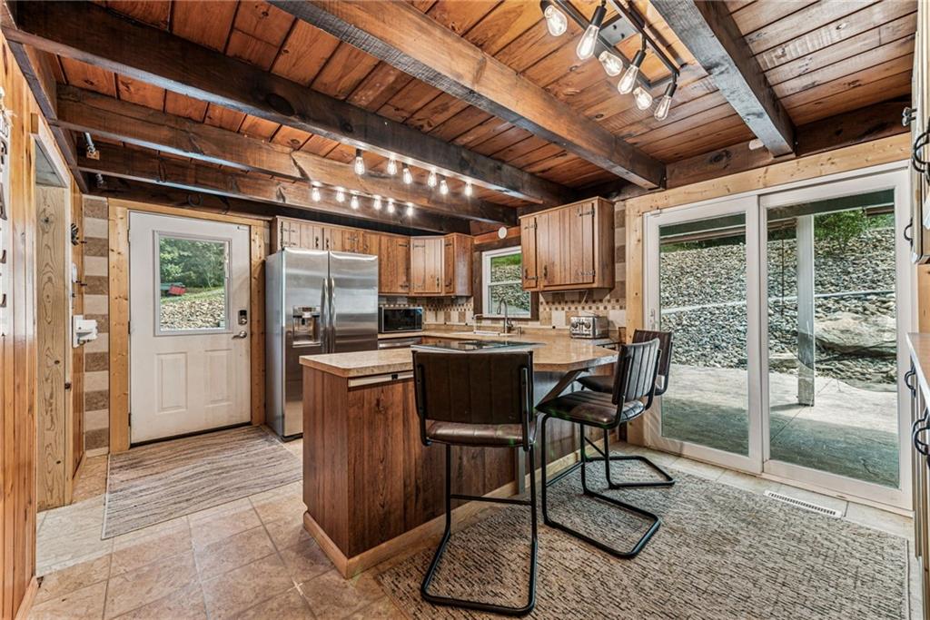 733 McKee Road White Oak, PA 15131 - Photo 15 of 36 a dining room with furniture and large windows