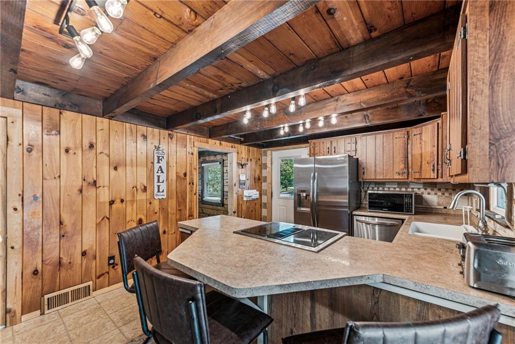 733 McKee Road White Oak, PA 15131 - Photo 17 of 36 a view of a dining table and chairs in the kitchen