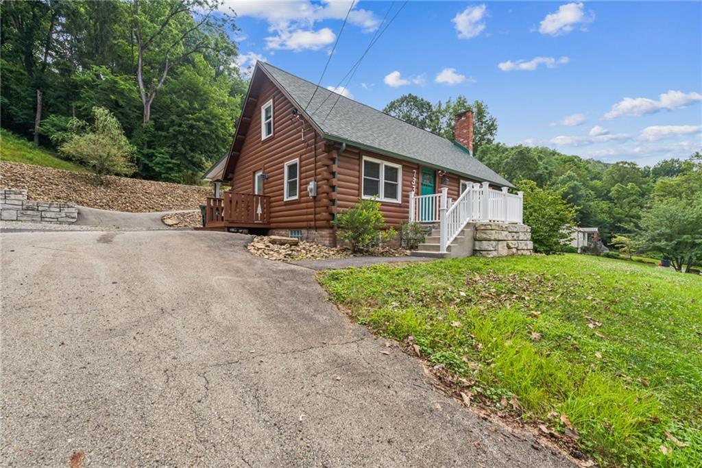 733 McKee Road White Oak, PA 15131 - Photo 2 of 36 a front view of a house with garden