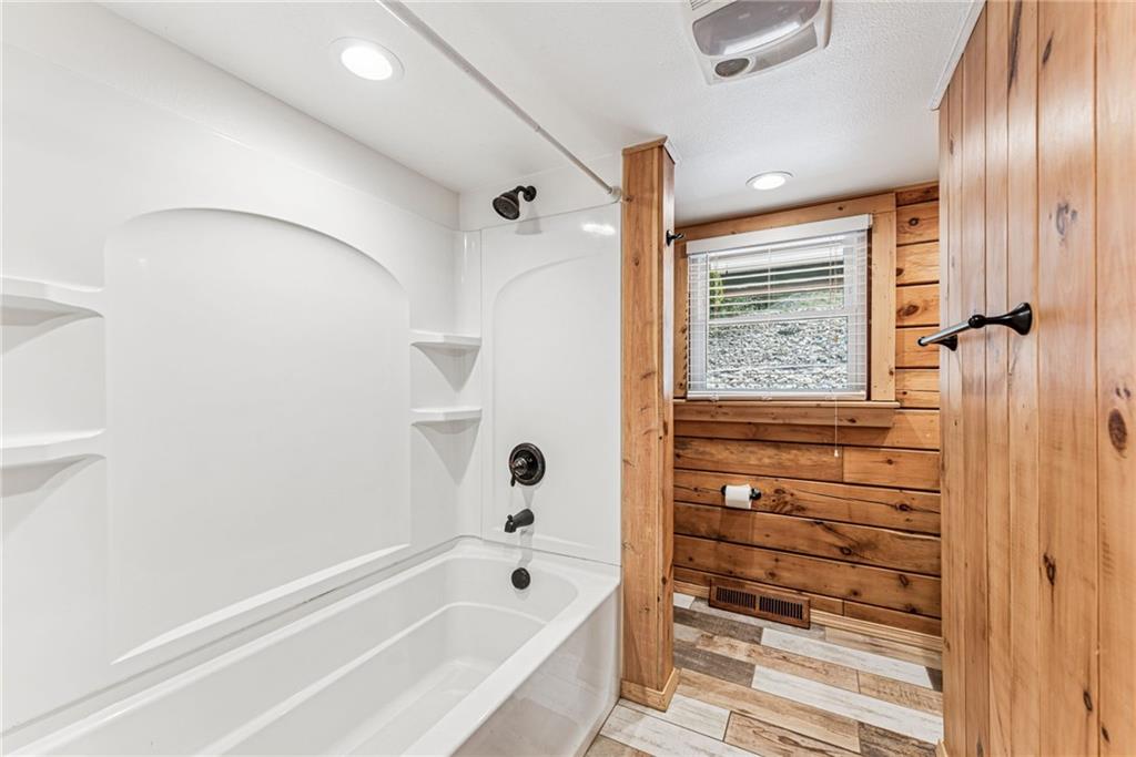 733 McKee Road White Oak, PA 15131 - Photo 21 of 36 a bathroom with a bathtub and a shower