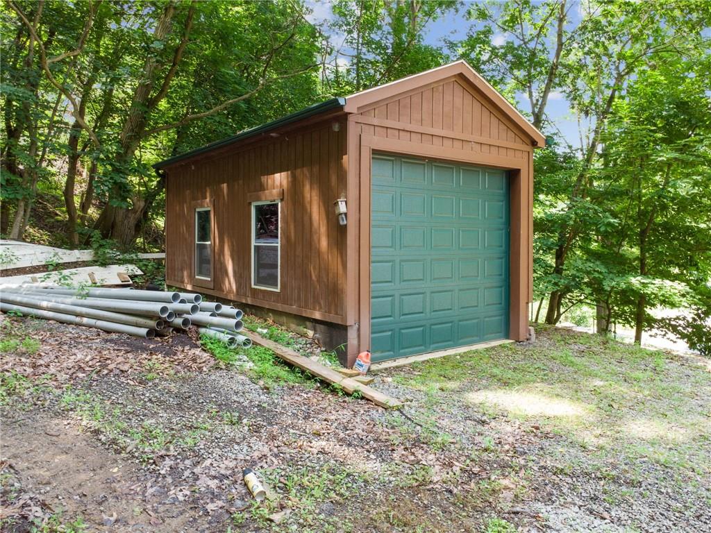 733 McKee Road White Oak, PA 15131 - Photo 33 of 36 a view of a house with a yard and large tree