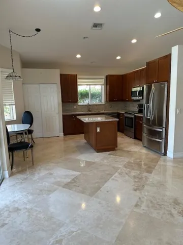 a living room with furniture tv and a window