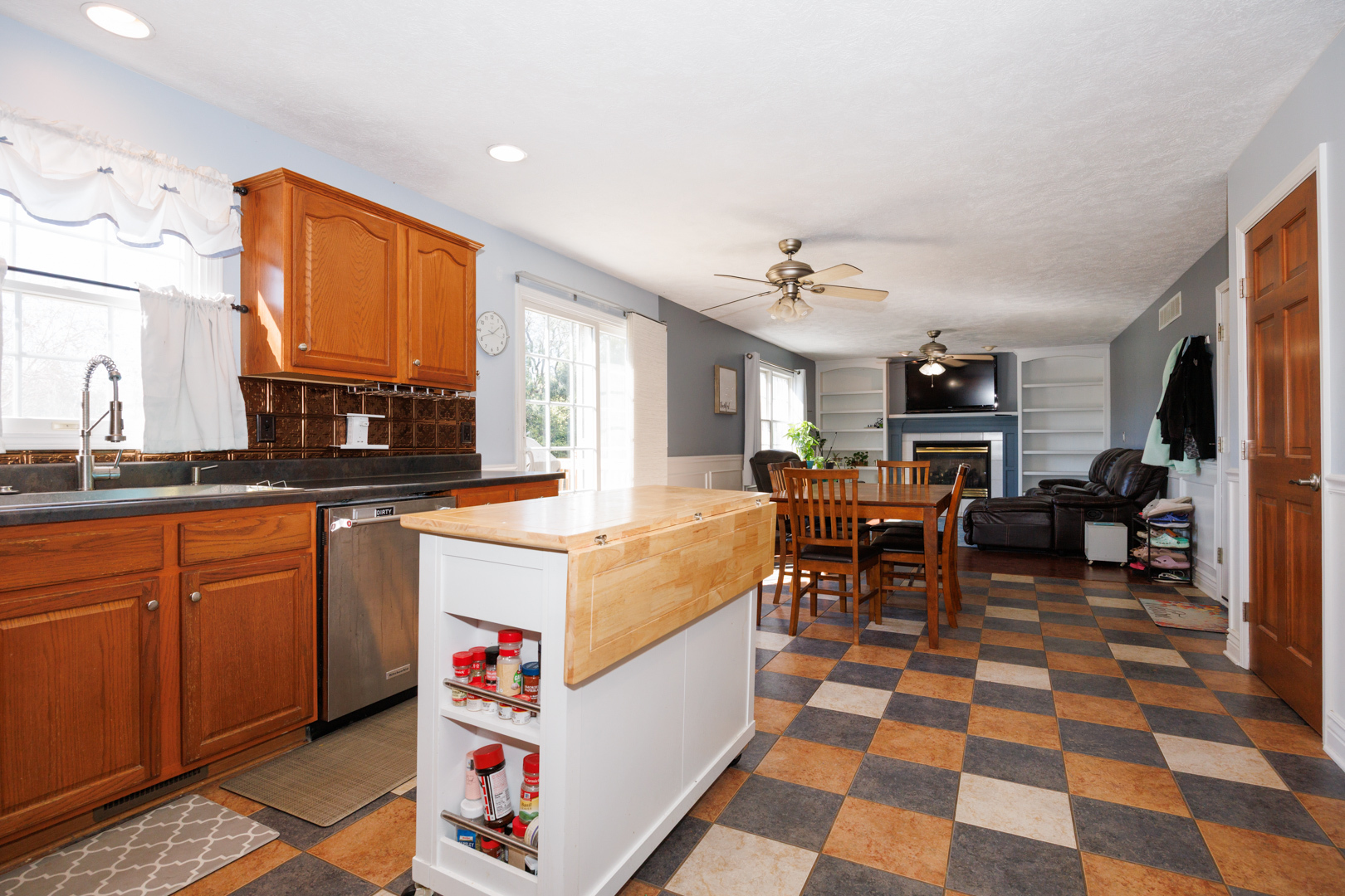 2405 Savanna Road Bloomington, IL 61705 - Photo 15 of 48 a very nice looking living room with a black and white kitchen