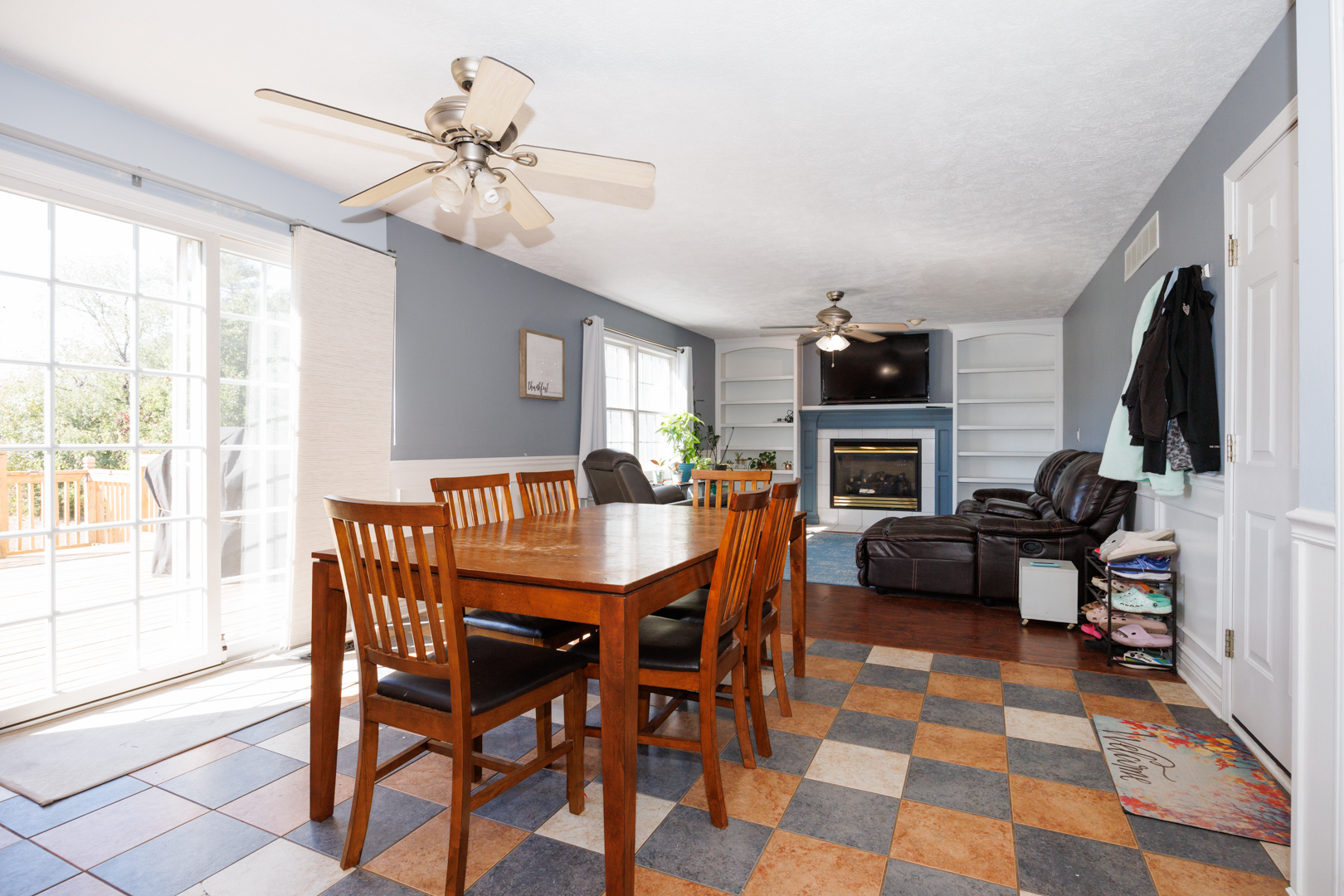2405 Savanna Road Bloomington, IL 61705 - Photo 16 of 48 a view of a dining room with furniture a chandelier and wooden floor