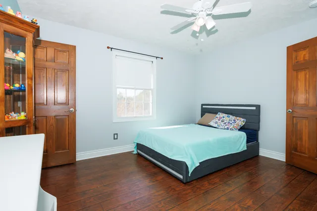 a bedroom with a bed and window