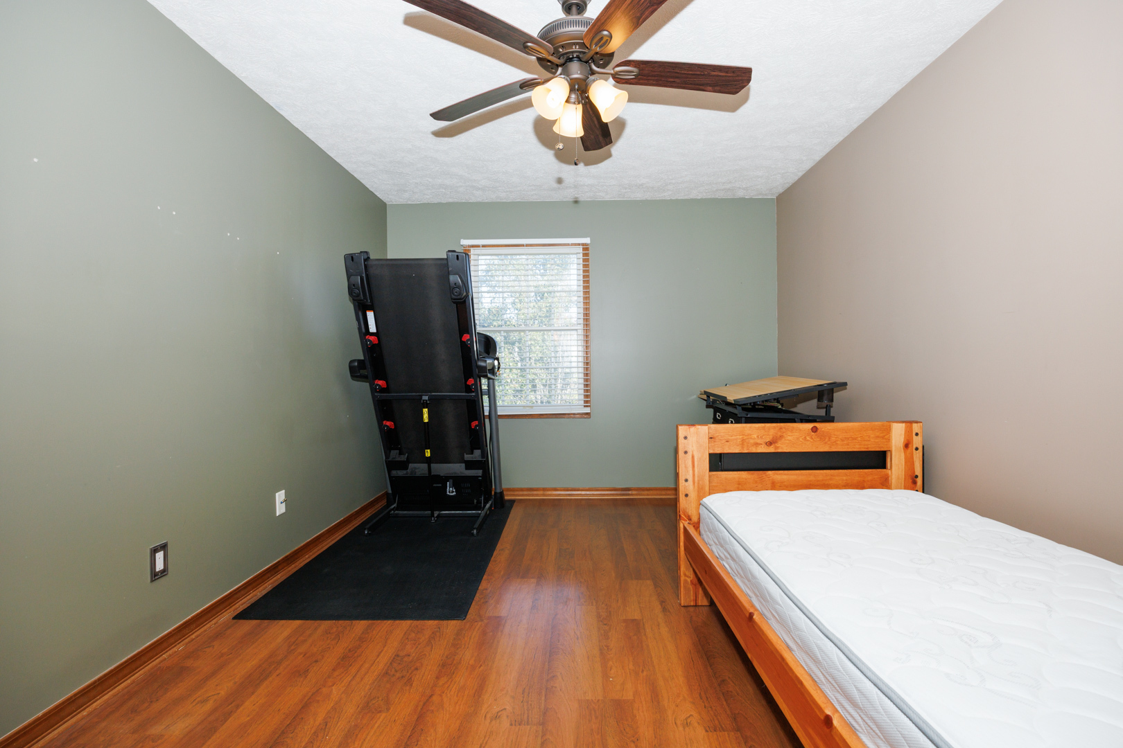 2405 Savanna Road Bloomington, IL 61705 - Photo 31 of 48 a room with a bed and wooden floor