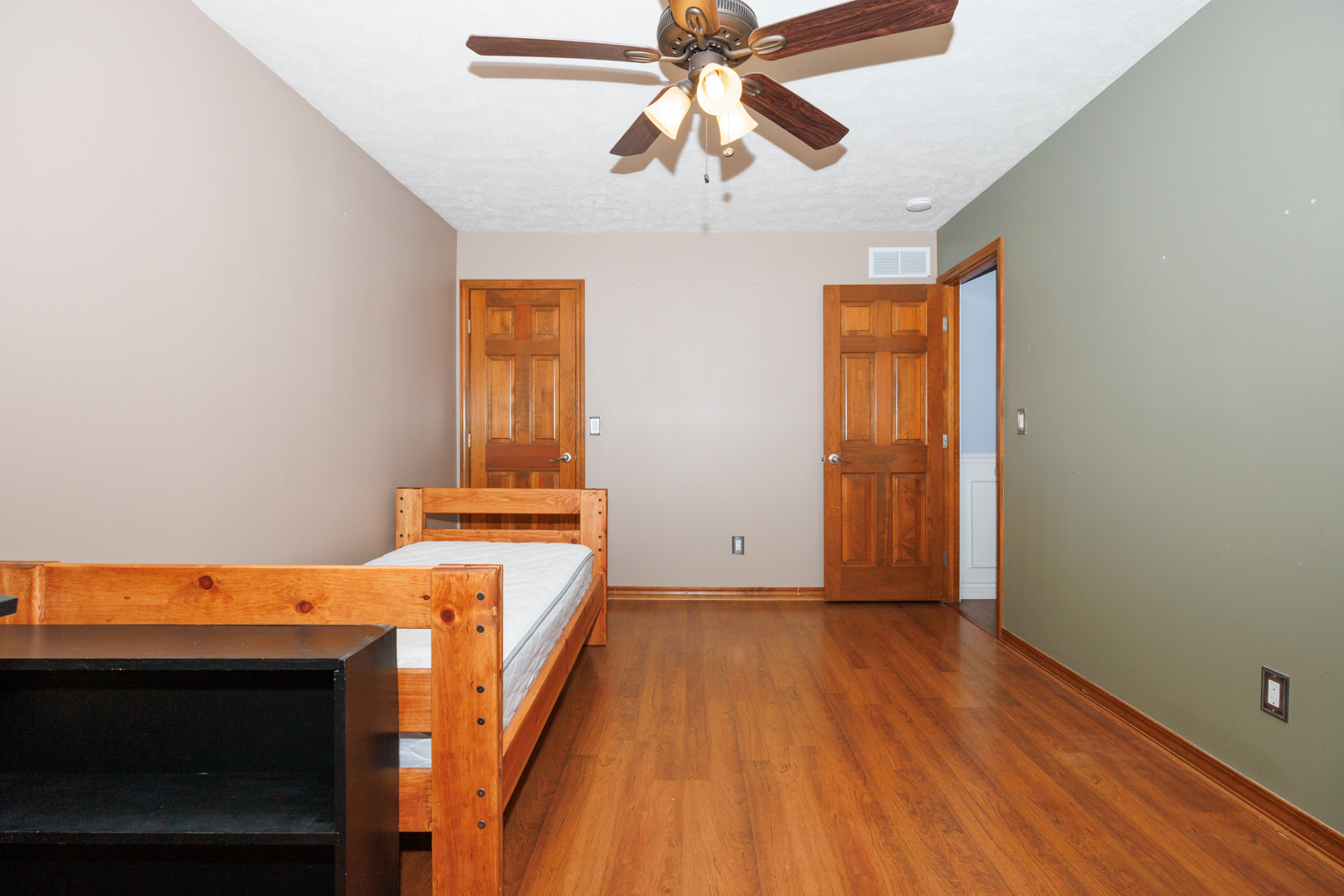 2405 Savanna Road Bloomington, IL 61705 - Photo 32 of 48 a bedroom with a bed and wooden floor