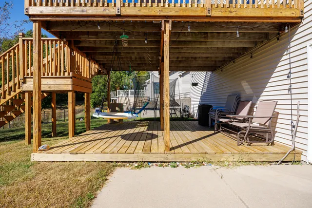 a view of a patio with table and chairs