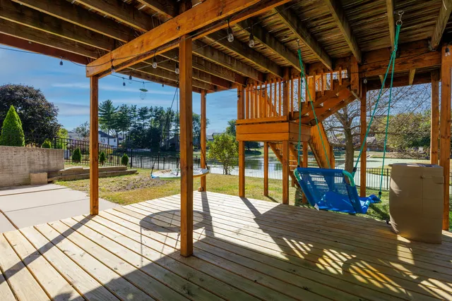 a view of a swimming pool with a porch