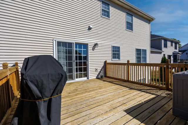 a view of balcony with wooden floor and fence