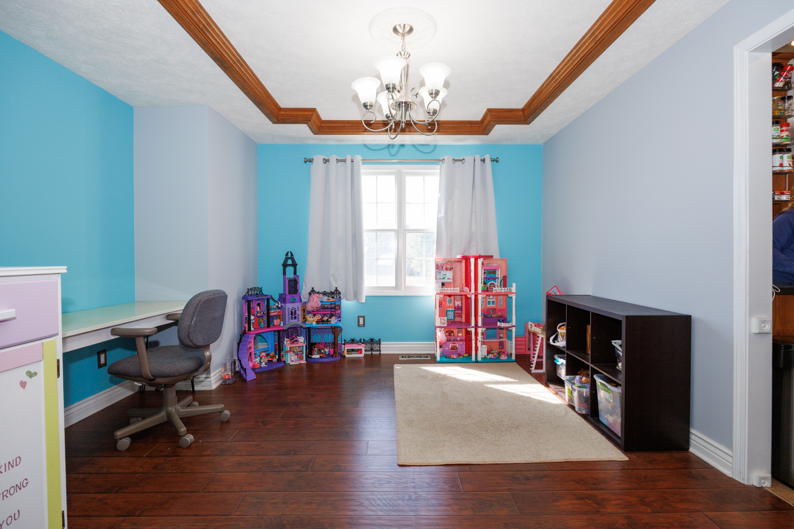 2405 Savanna Road Bloomington, IL 61705 - Photo 7 of 48 a living room with furniture and a chandelier