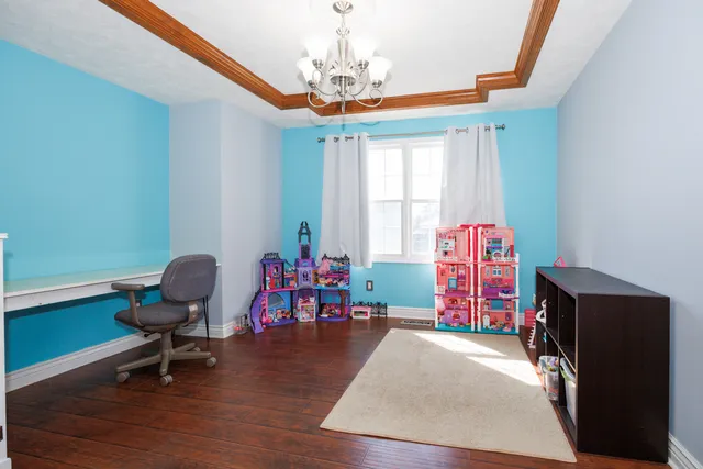 a bedroom with furniture and a window