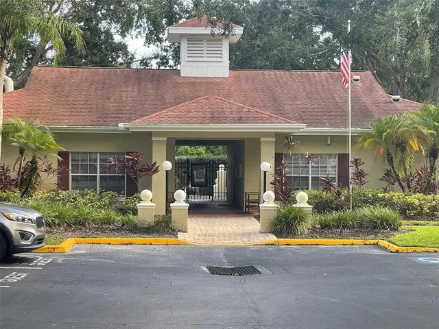 a view of a house with backyard outdoor seating area and swimming pool