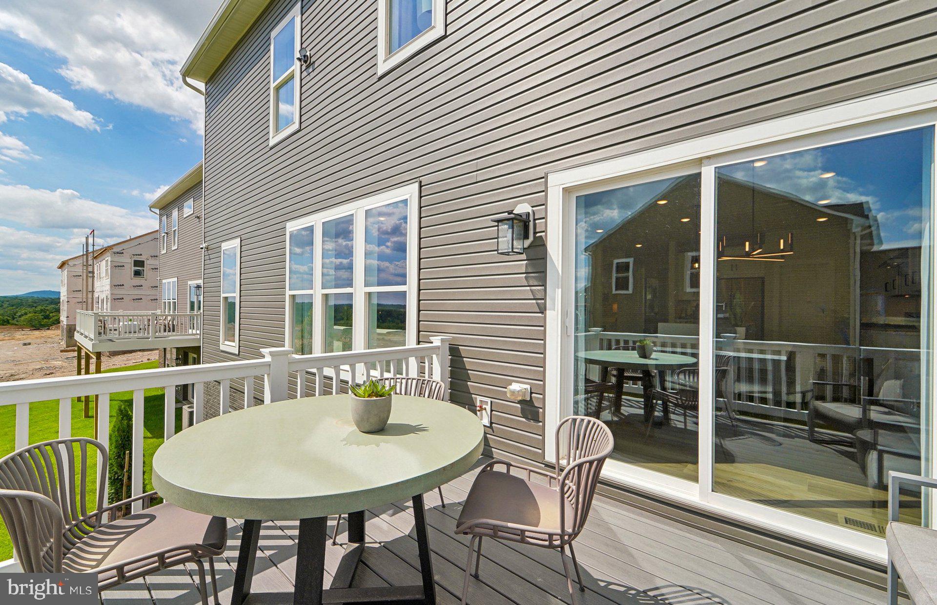 22513 Sculpin Brk Road Boyds, MD 20841 - Photo 43 of 53 a balcony with table and chairs