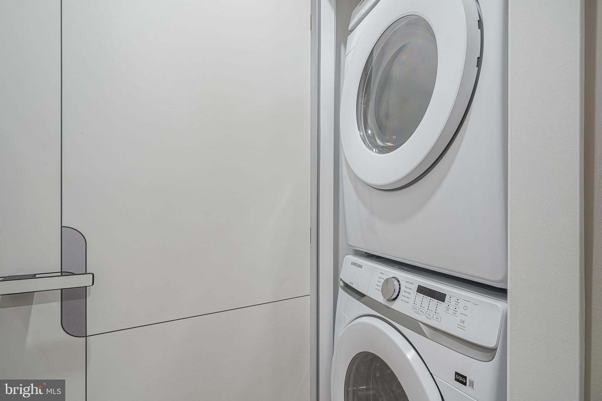 4432-00 Wingate Street, Unit 104 Philadelphia, PA 19136 - Photo 22 of 32 a utility room with dryer and washer