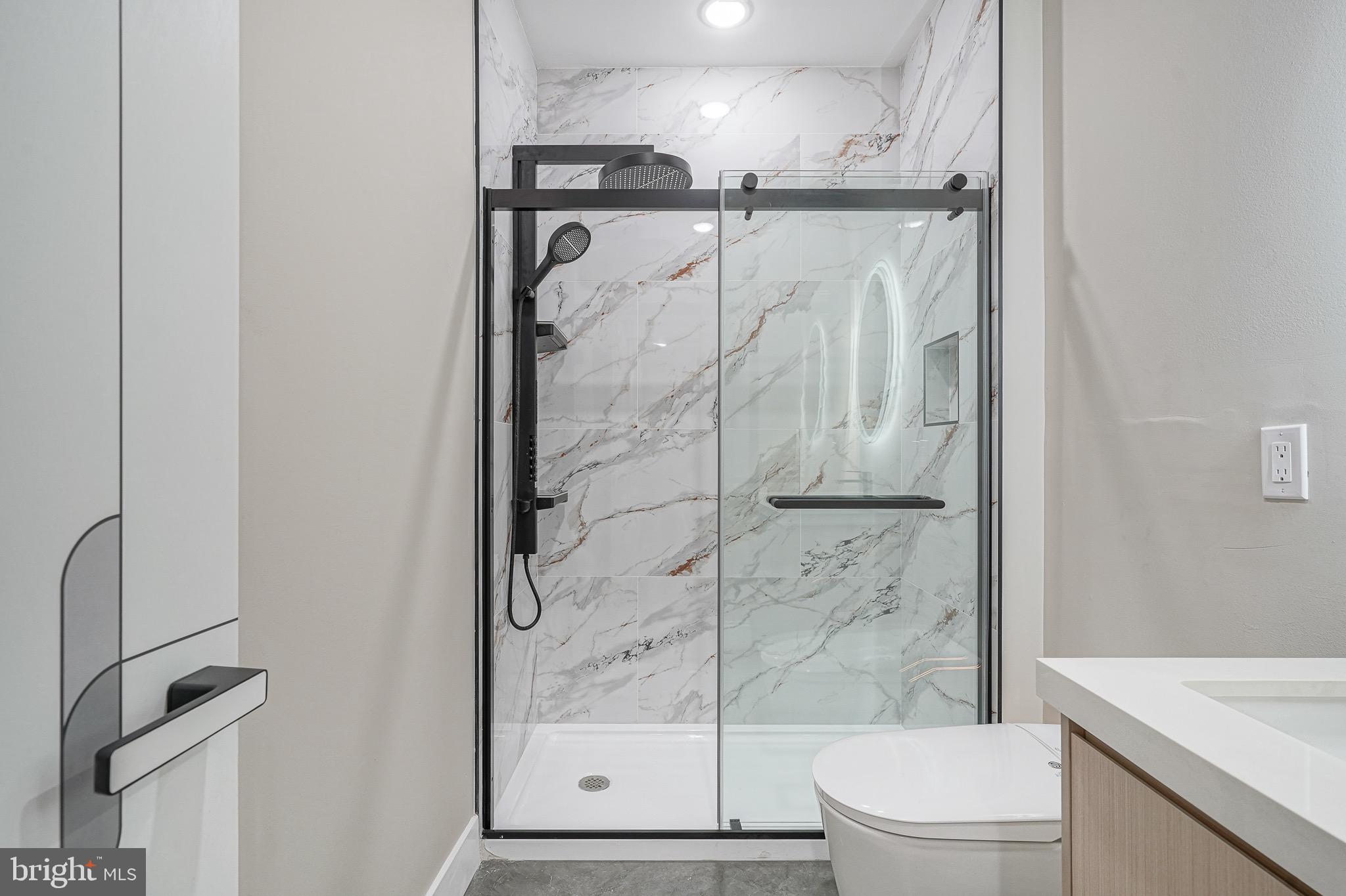 4432-00 Wingate Street, Unit 104 Philadelphia, PA 19136 - Photo 28 of 32 a bathroom with a shower and a toilet