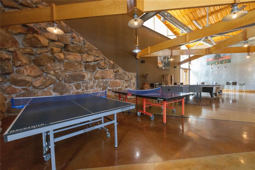 51 D Hensley Road Gordon, TX 76453 - Photo 17 of 29 a room with lots of tables a chandelier and couches