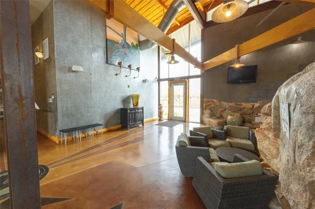 a view of livingroom with furniture and windows