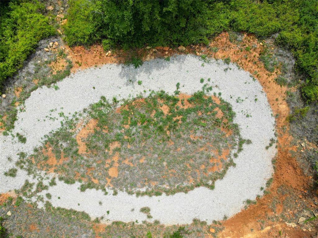 51 D Hensley Road Gordon, TX 76453 - Photo 8 of 29 a view of a lake in between of trees