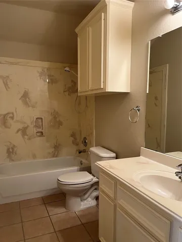 a bathroom with a toilet a sink and bathtub