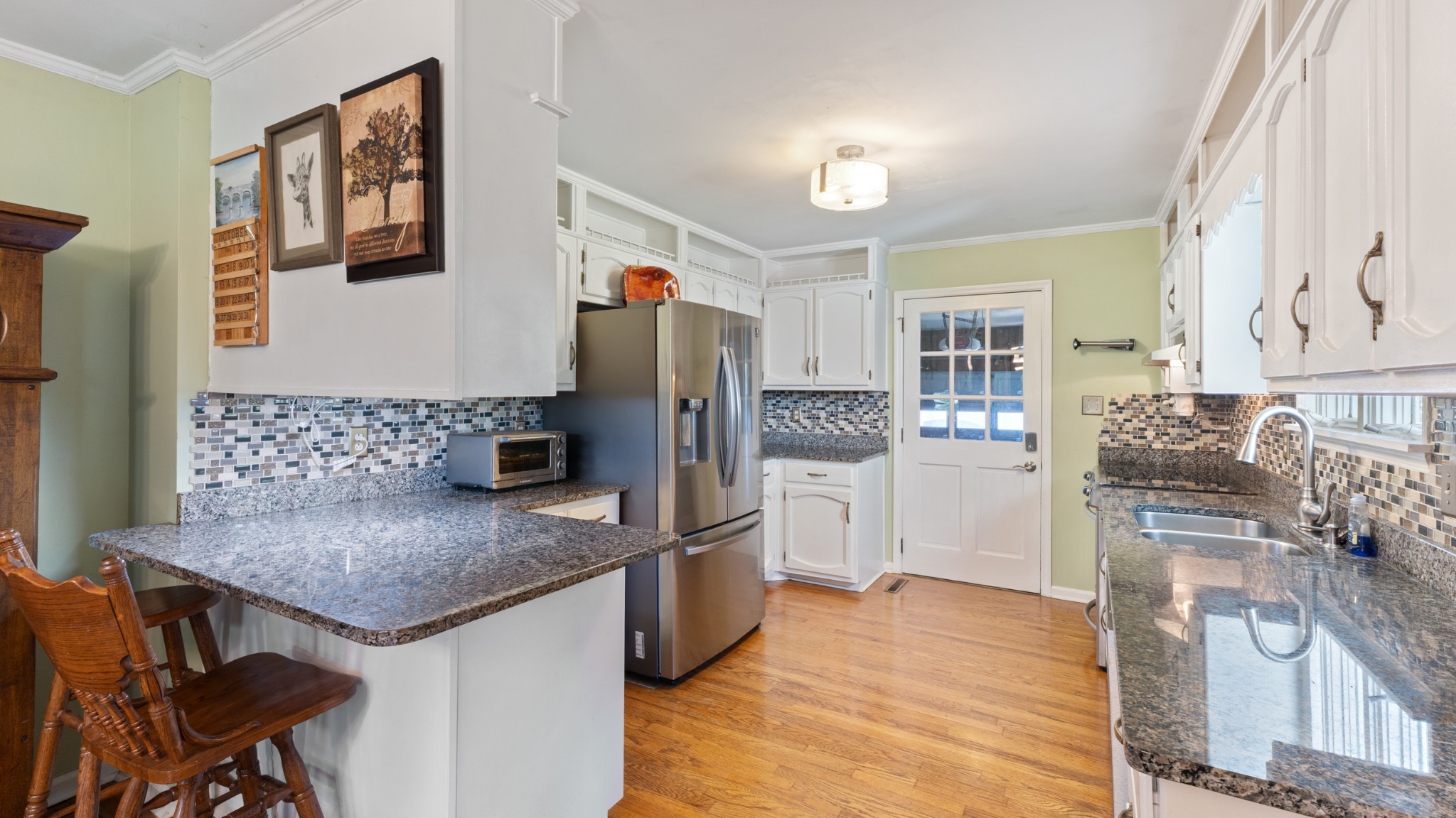 7 Scott Orchard Road Taft, TN 38488 - Photo 15 of 50 a kitchen with stainless steel appliances granite countertop a refrigerator and a stove top oven