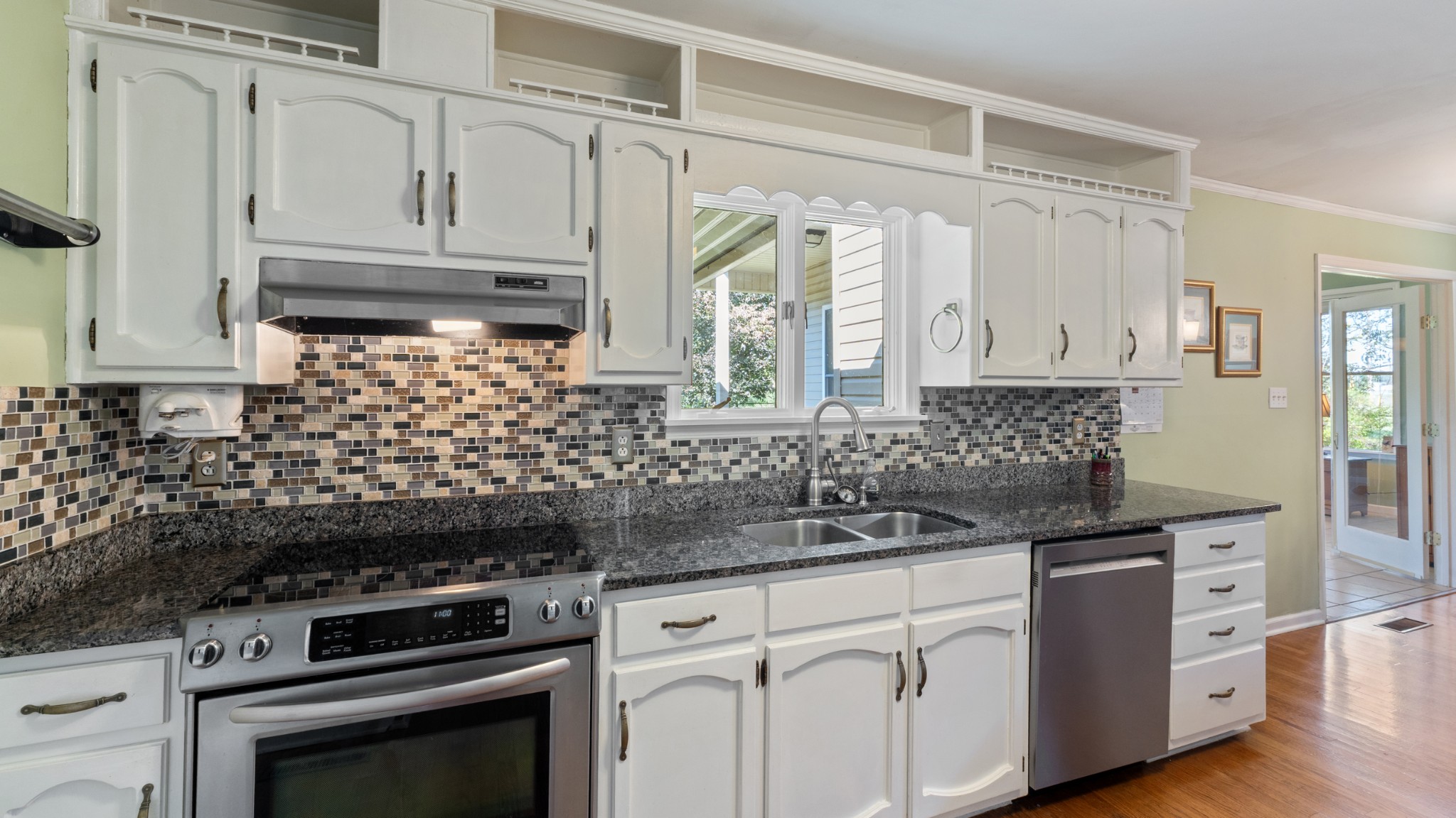7 Scott Orchard Road Taft, TN 38488 - Photo 16 of 50 a kitchen with granite countertop white cabinets and appliances