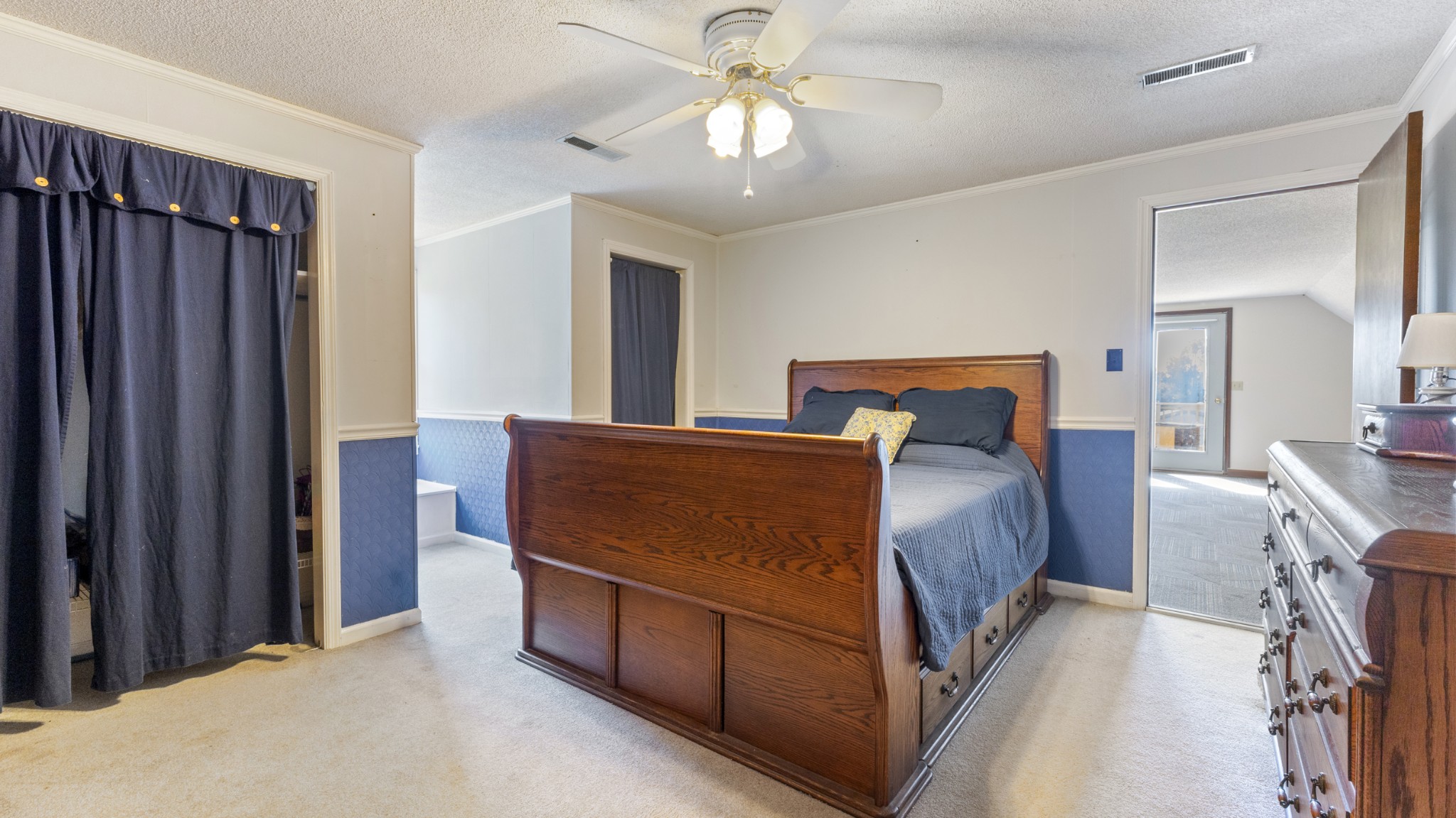 7 Scott Orchard Road Taft, TN 38488 - Photo 29 of 50 a bedroom with a bed and a chandelier