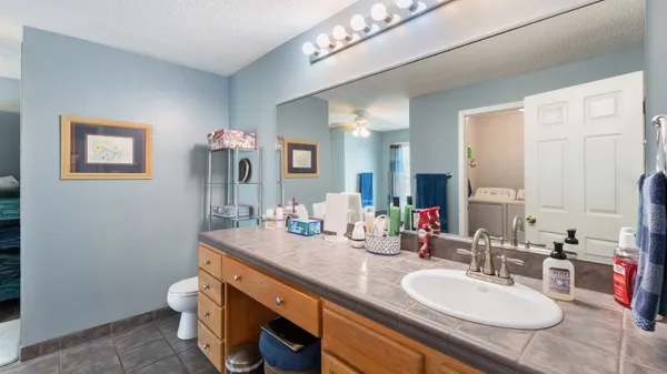 a bathroom with a toilet sink and shower