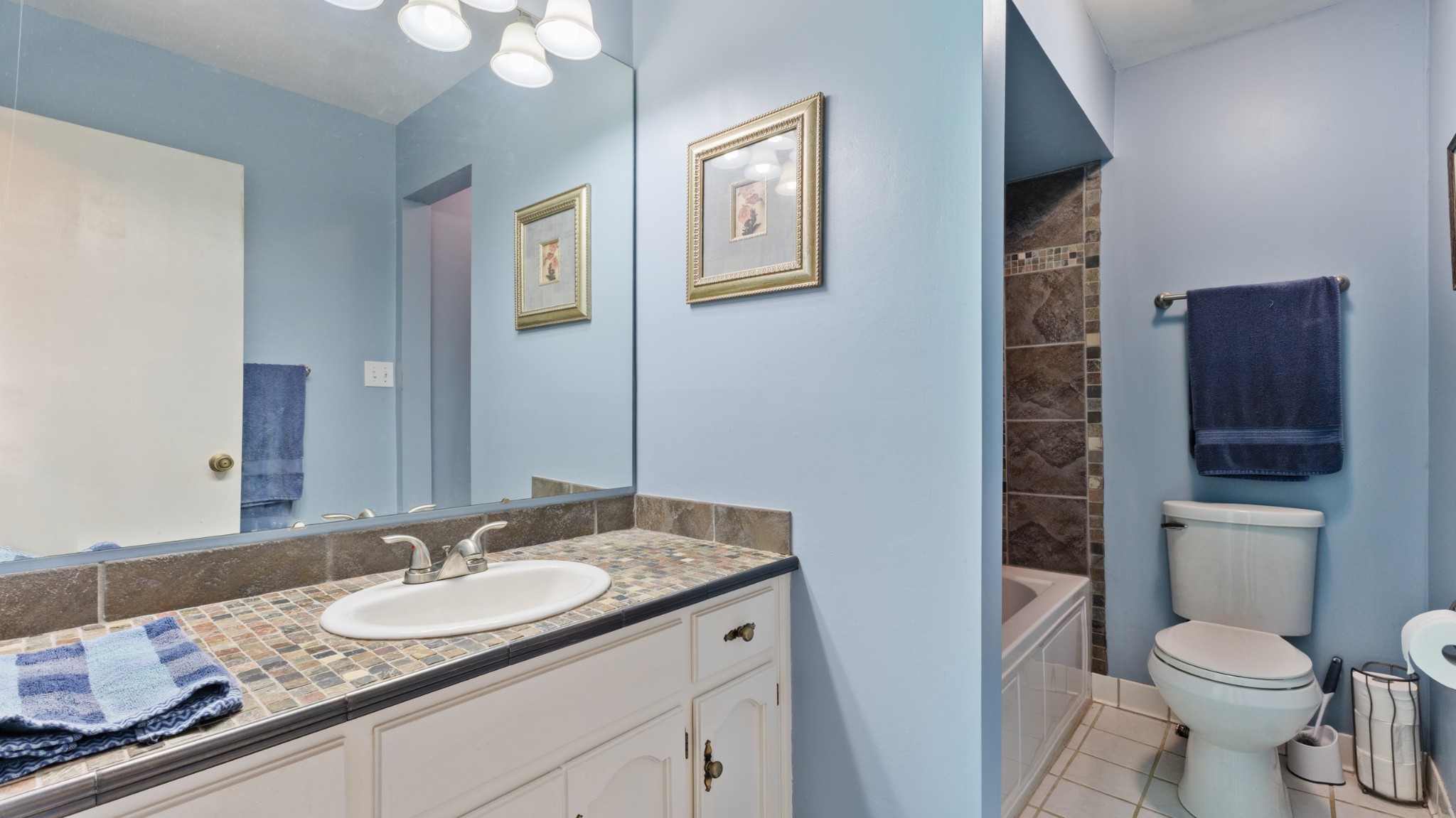 7 Scott Orchard Road Taft, TN 38488 - Photo 41 of 50 a bathroom with a granite countertop toilet sink and mirror