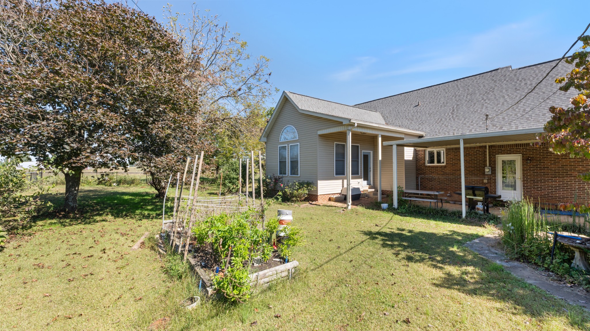 7 Scott Orchard Road Taft, TN 38488 - Photo 5 of 50 a view of a house with backyard sitting area and garden