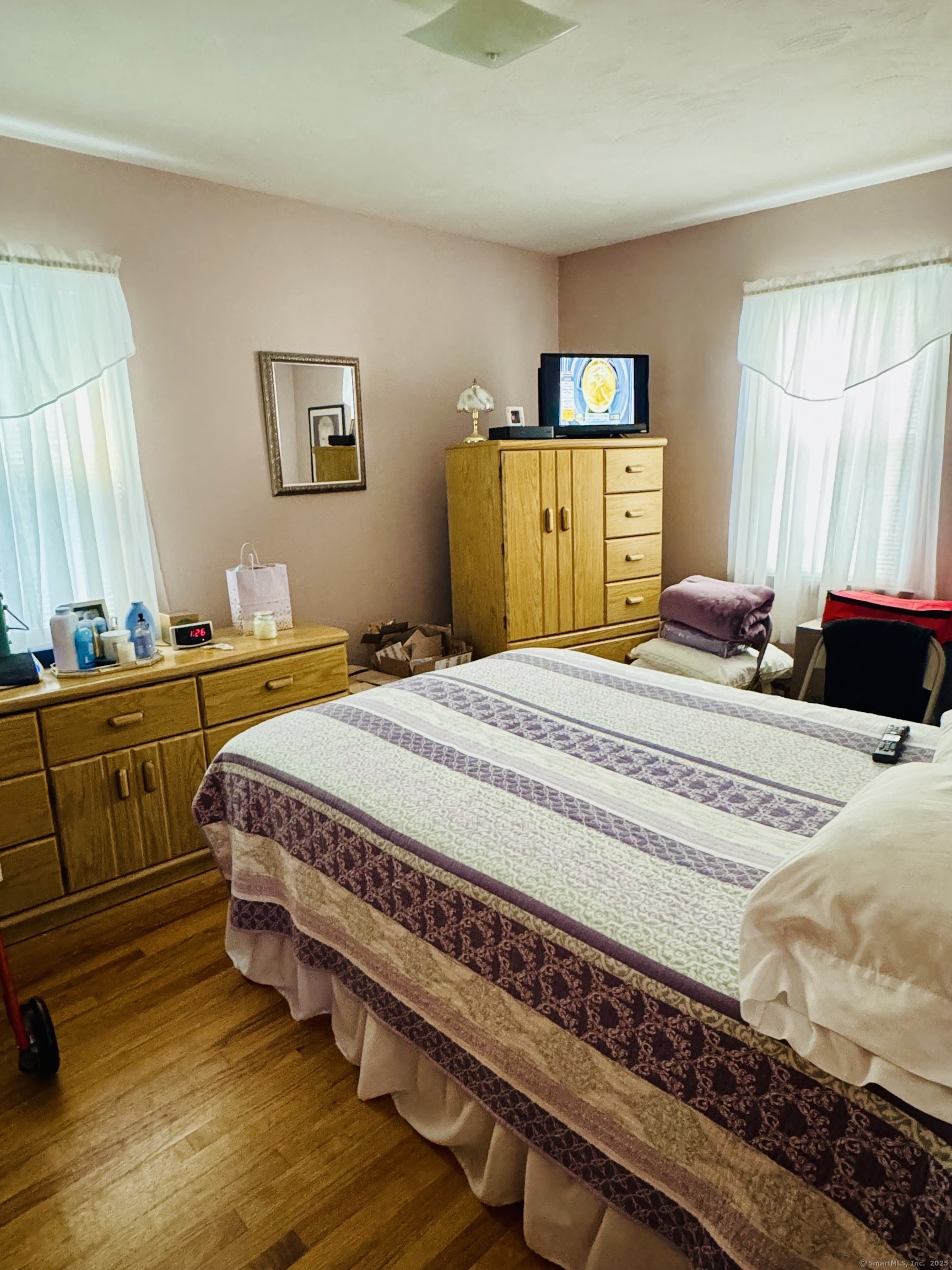 41 Pardee Street Bristol, CT 06010 - Photo 4 of 7 a bedroom with a bed and wooden floor