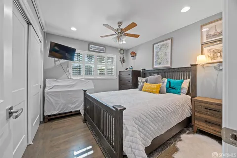 a view of a livingroom with workspace and a window