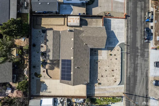 an aerial view of houses with outdoor space
