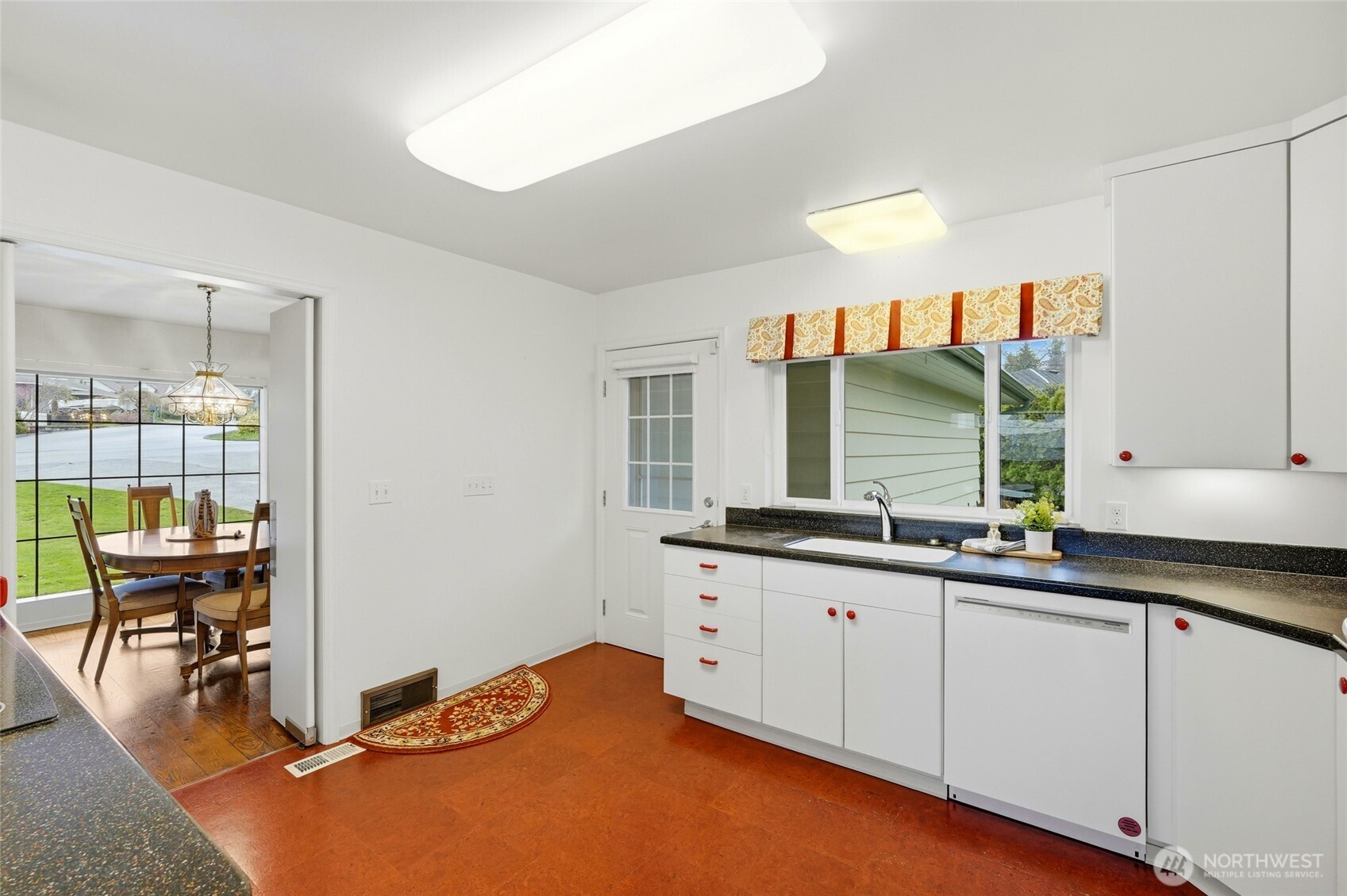 456 View Ridge Drive Everett, WA 98203 - Photo 18 of 40 a kitchen with stainless steel appliances granite countertop a sink and cabinets