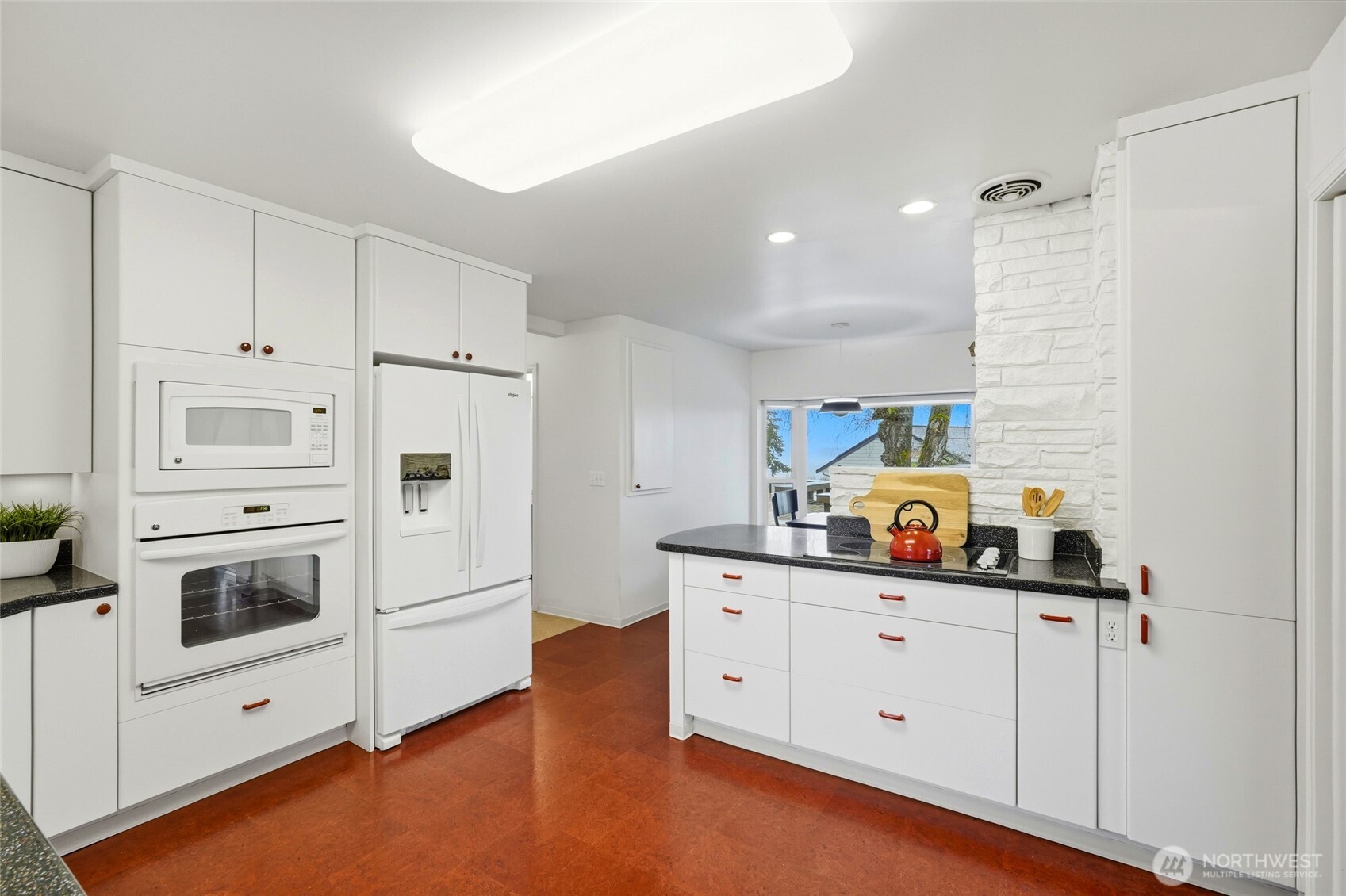 456 View Ridge Drive Everett, WA 98203 - Photo 19 of 40 a kitchen with stainless steel appliances a stove a sink and white cabinets