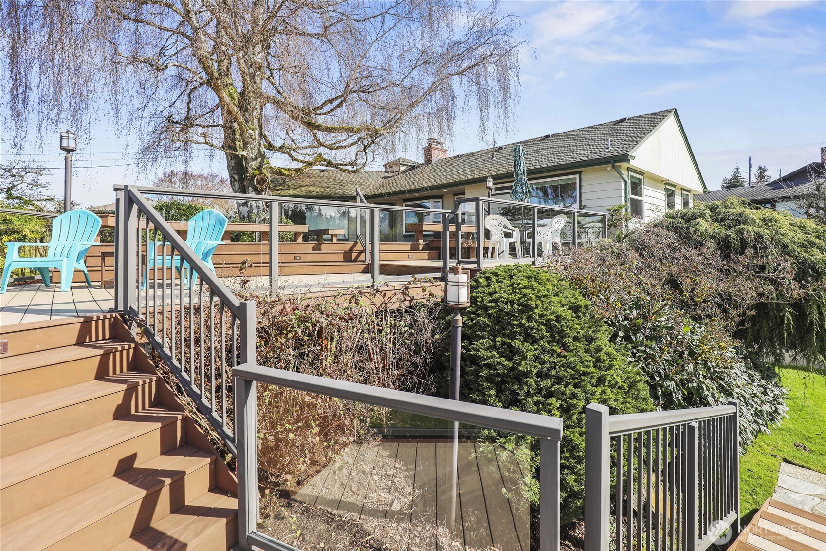 456 View Ridge Drive Everett, WA 98203 - Photo 37 of 40 a view of a house with wooden stairs and a large tree
