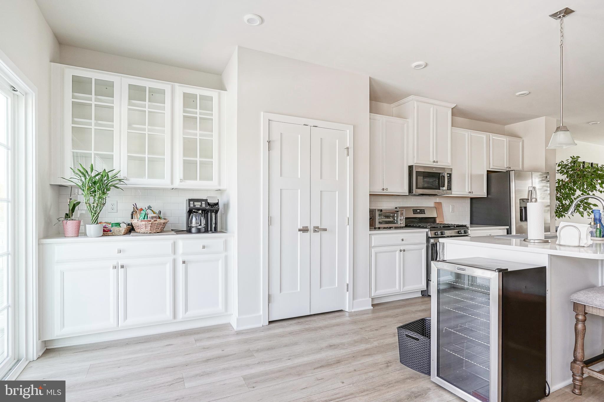 188 Freedom Way Sicklerville, NJ 08081 - Photo 12 of 32 a kitchen with white cabinets and stainless steel appliances