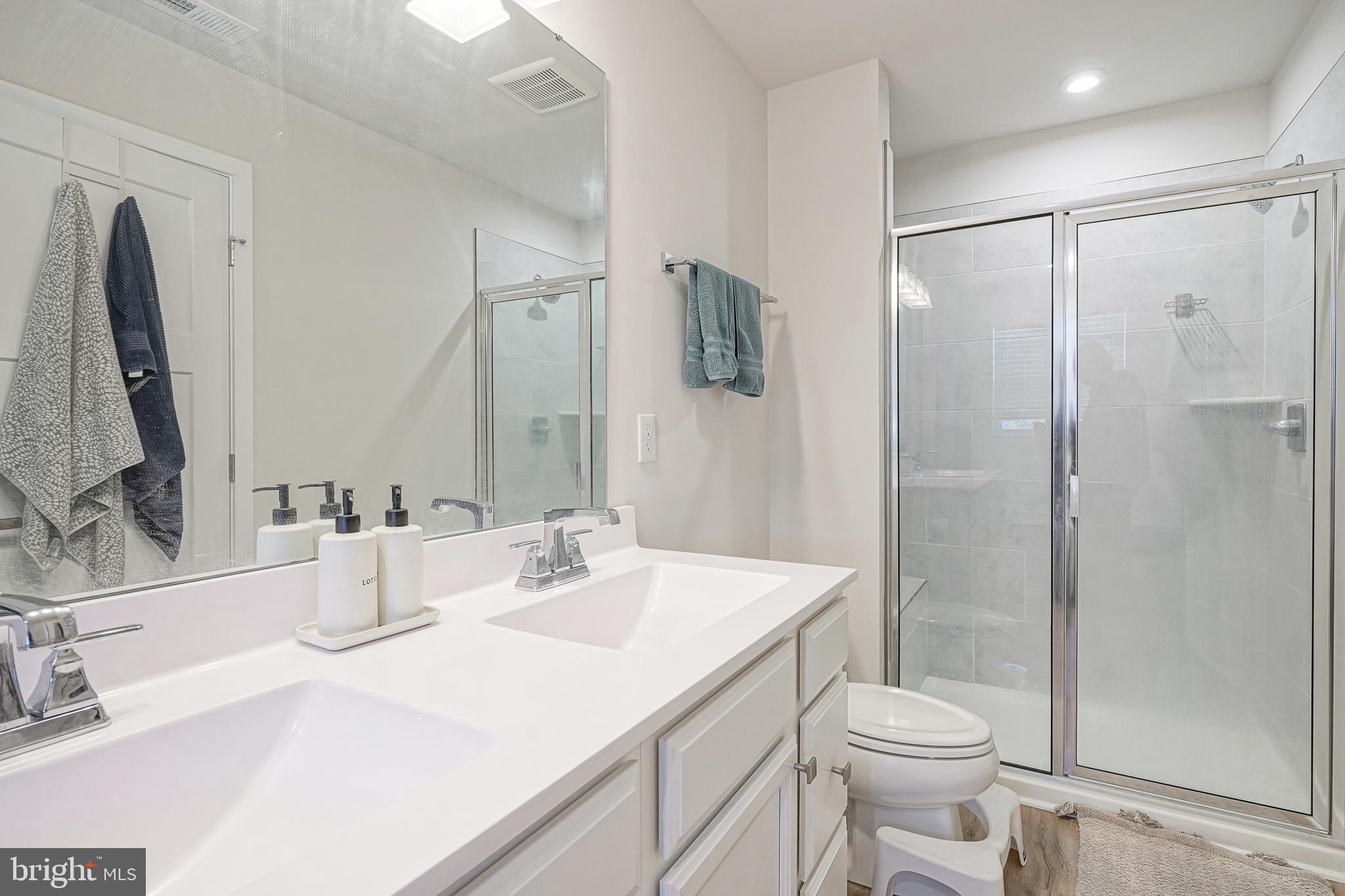 188 Freedom Way Sicklerville, NJ 08081 - Photo 16 of 32 a bathroom with a sink a toilet a mirror and shower