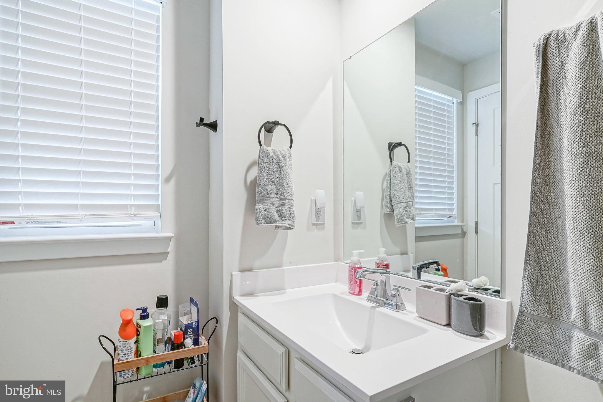 188 Freedom Way Sicklerville, NJ 08081 - Photo 20 of 32 a bathroom with a sink vanity and a mirror