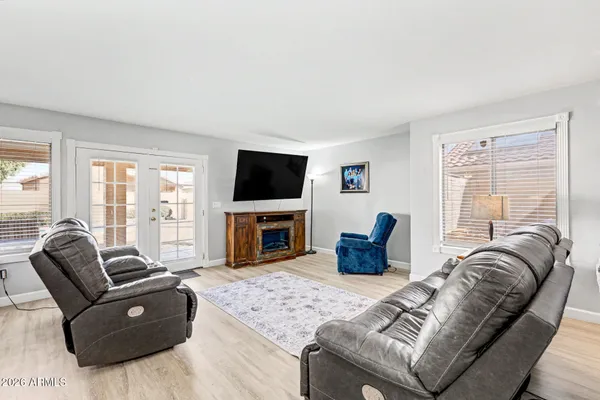 a living room with furniture fireplace and a flat screen tv