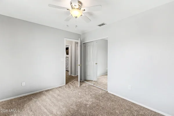 an empty room with a view of a bathroom