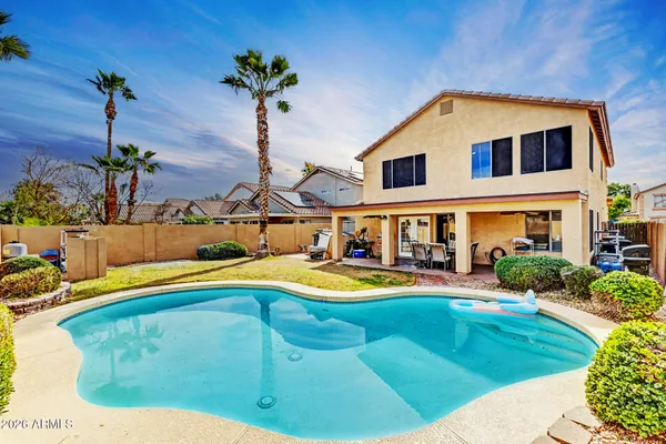 a house view with a swimming pool