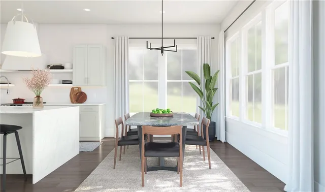 a dining room with furniture and window