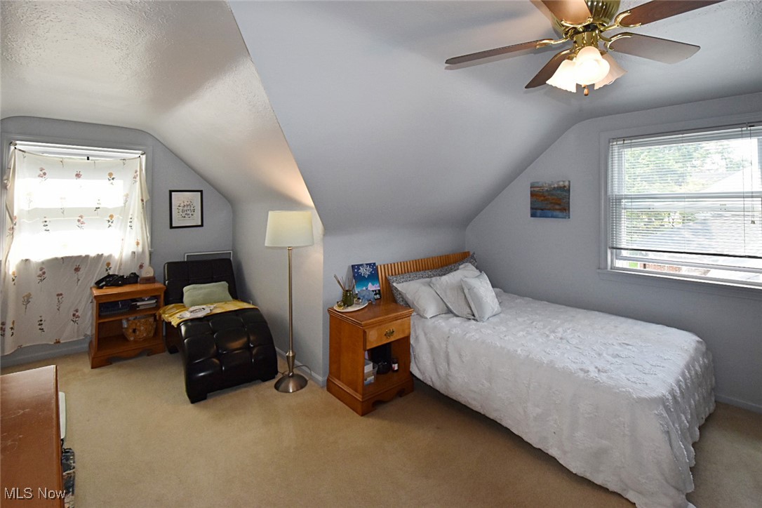 1388 Ford Road Lyndhurst, OH 44124 - Photo 26 of 39 Carpeted bedroom featuring a textured ceiling, ceiling fan, and vaulted ceiling